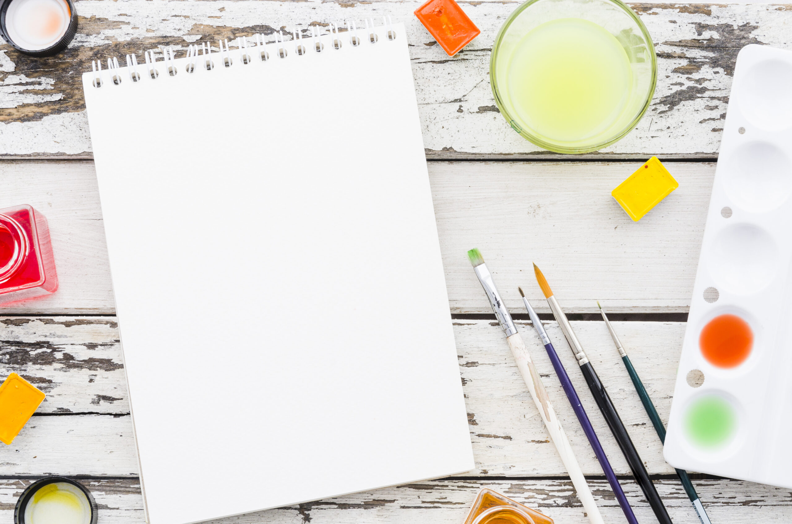 top-view-empty-notebook-with-painting-material